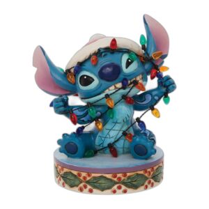 Stitch emmêlé dans la guirlande de Noël
